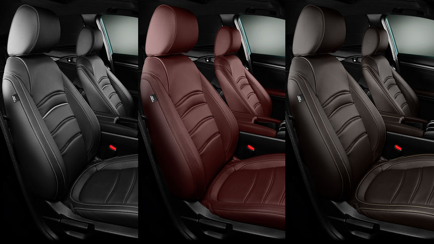 Närbild på läderklädsel i färgerna Bordeaux Red, Midnight Black och Dark Brown i en Honda Civic 5-dörrars.