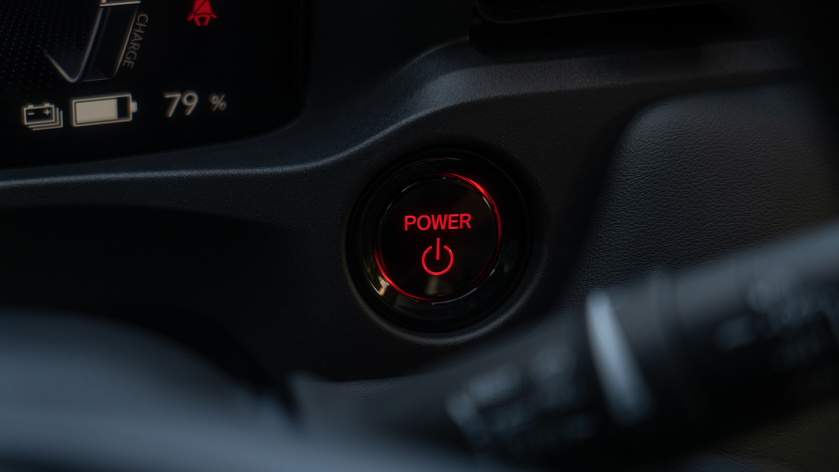 Närbild av tändningsknappen i Honda e:Ny1.