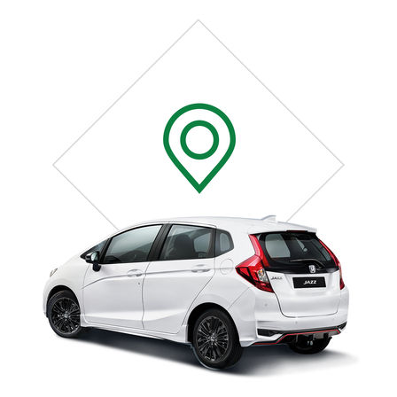 Trekvartsvy bakifrån på Honda Jazz med bild på återförsäljare.