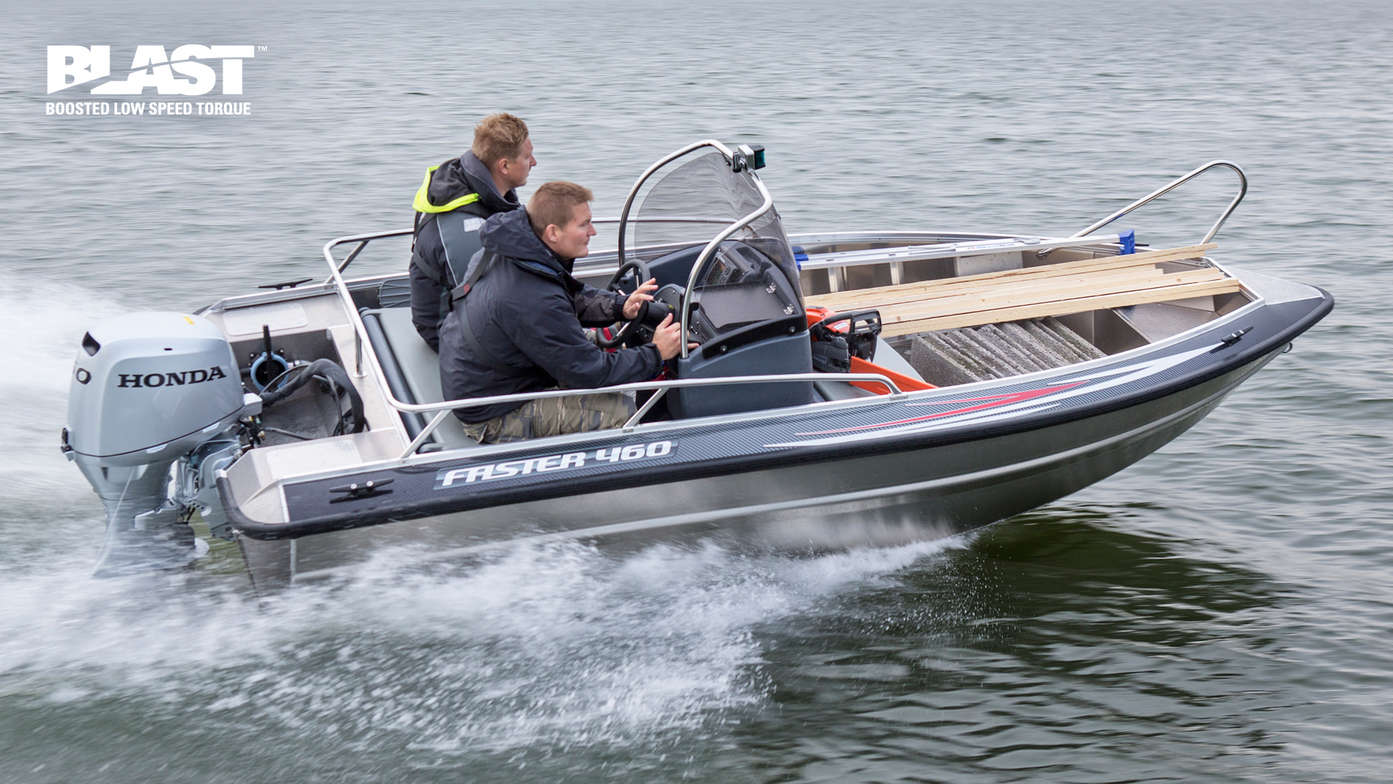 Boat using Honda engine, being used by models, coastal location.