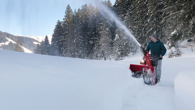 far away shot of snowthrower being used in deep snow