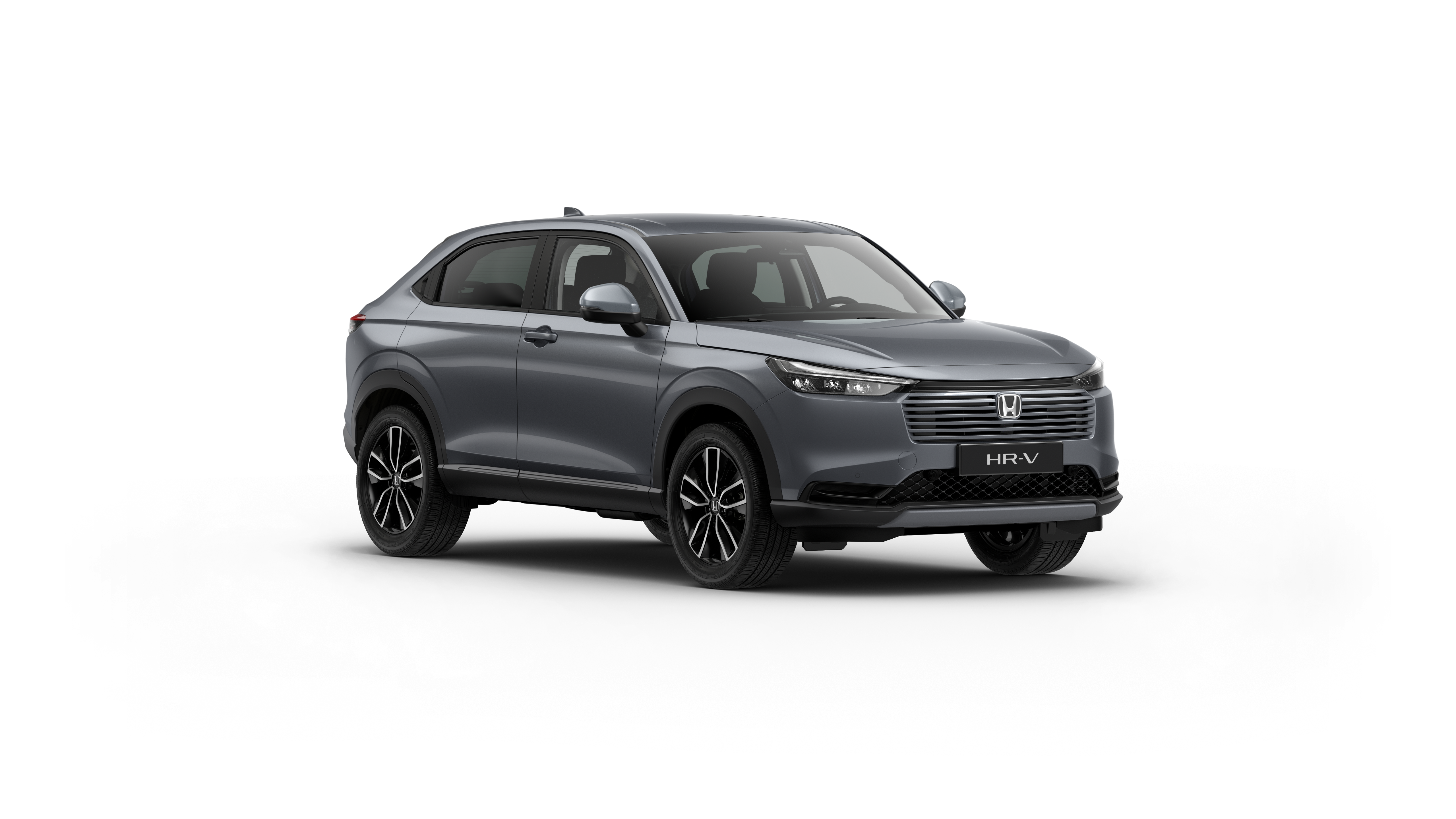 En grå Honda HR-V Elegance sedd 3/4 framifrån